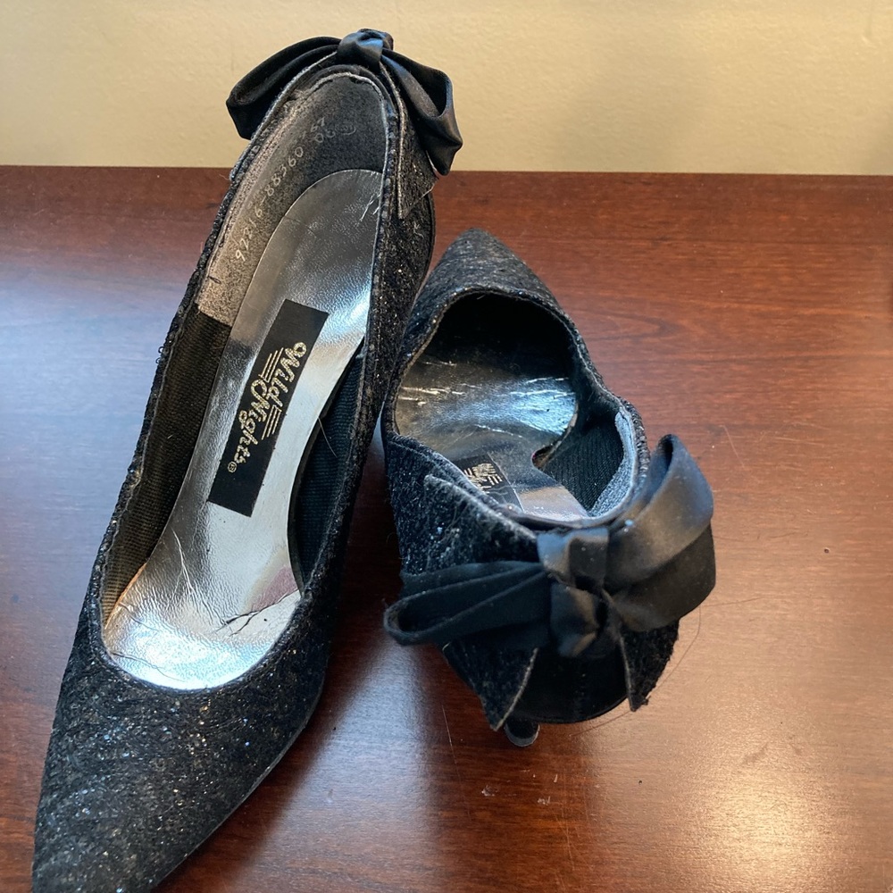Black high heels sparkle shoes with bow on back. Size 6.5